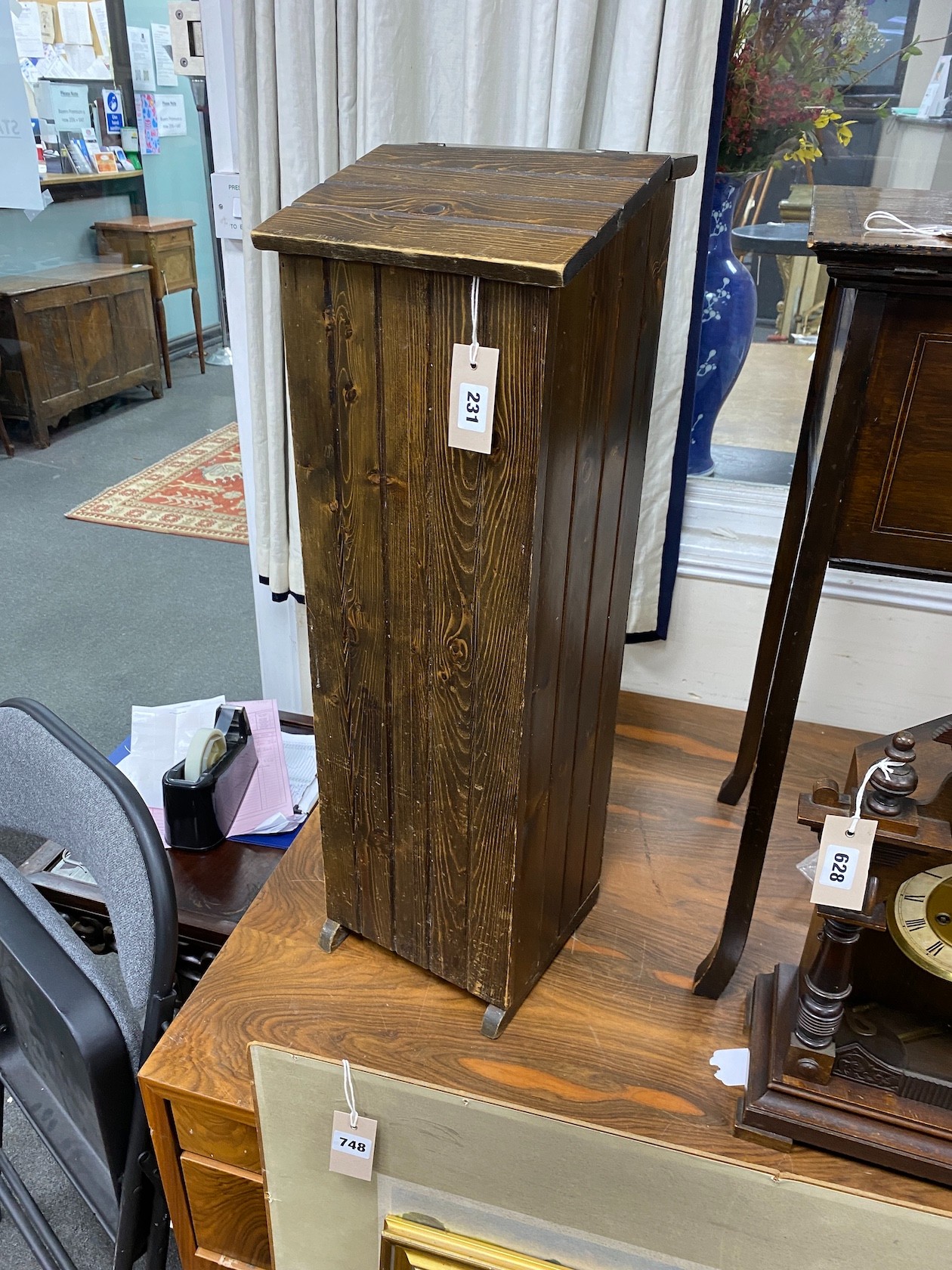 A stained pine baguette box, height 77cm